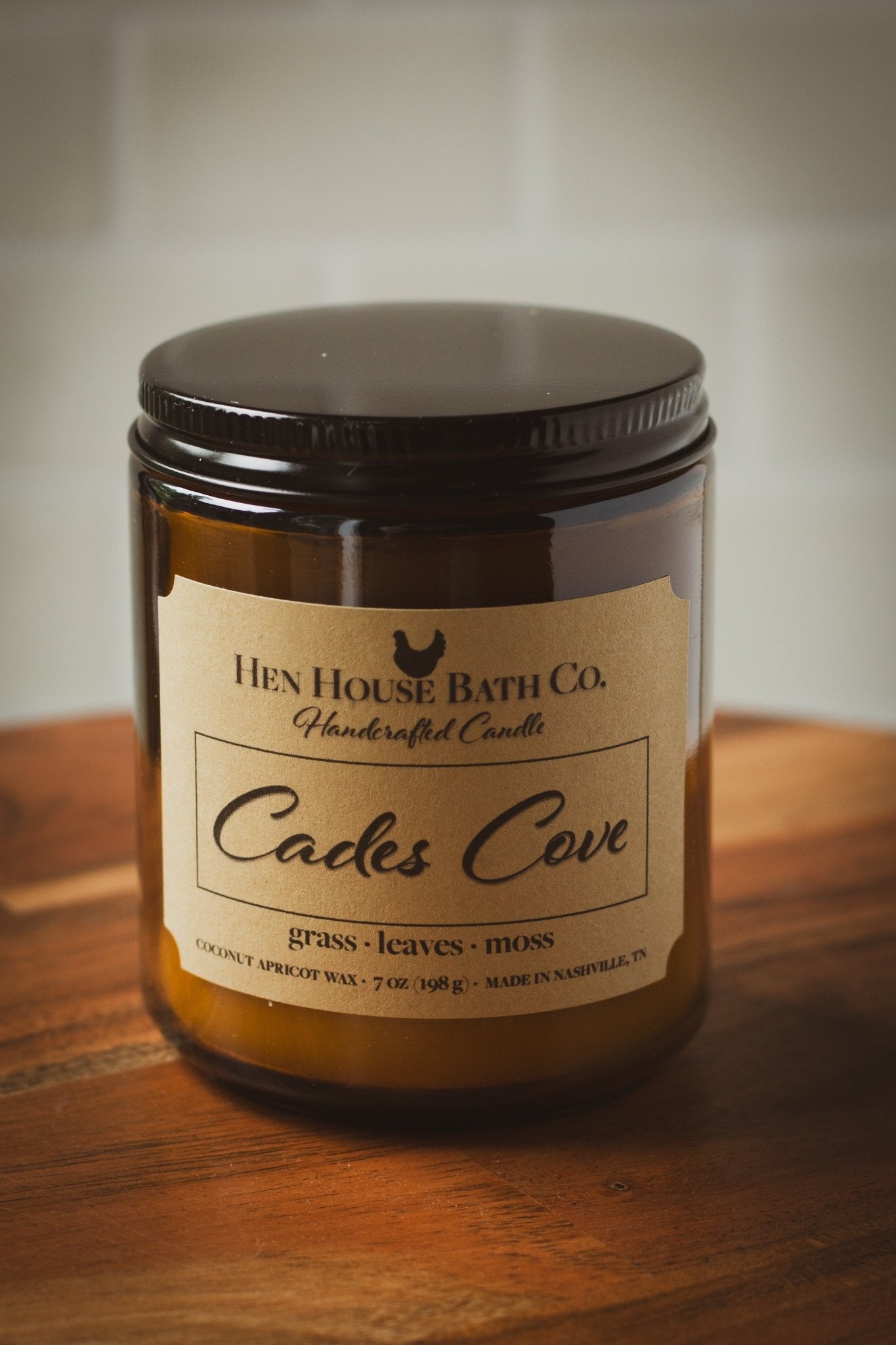 Smoky Mountain inspired - Cades Cove hand-poured candle fresh cut grass scent, in amber jar on rustic wood background by Hen House Bath Co.